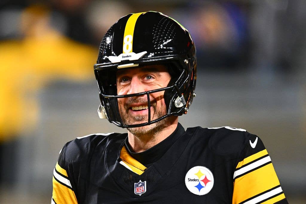 photo of aaron rodgers in steelers jersey and helmet