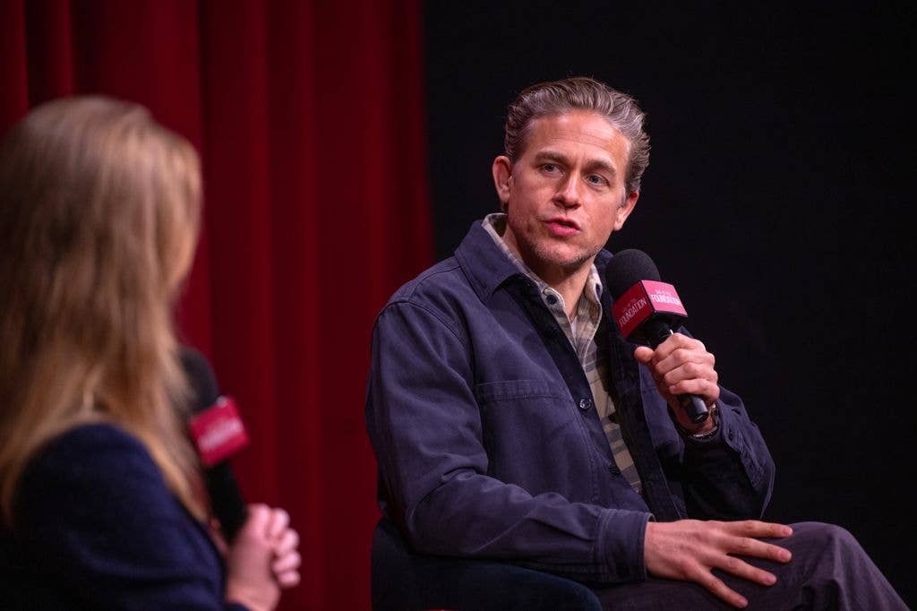 Charlie onstage with journalist Kara Warner