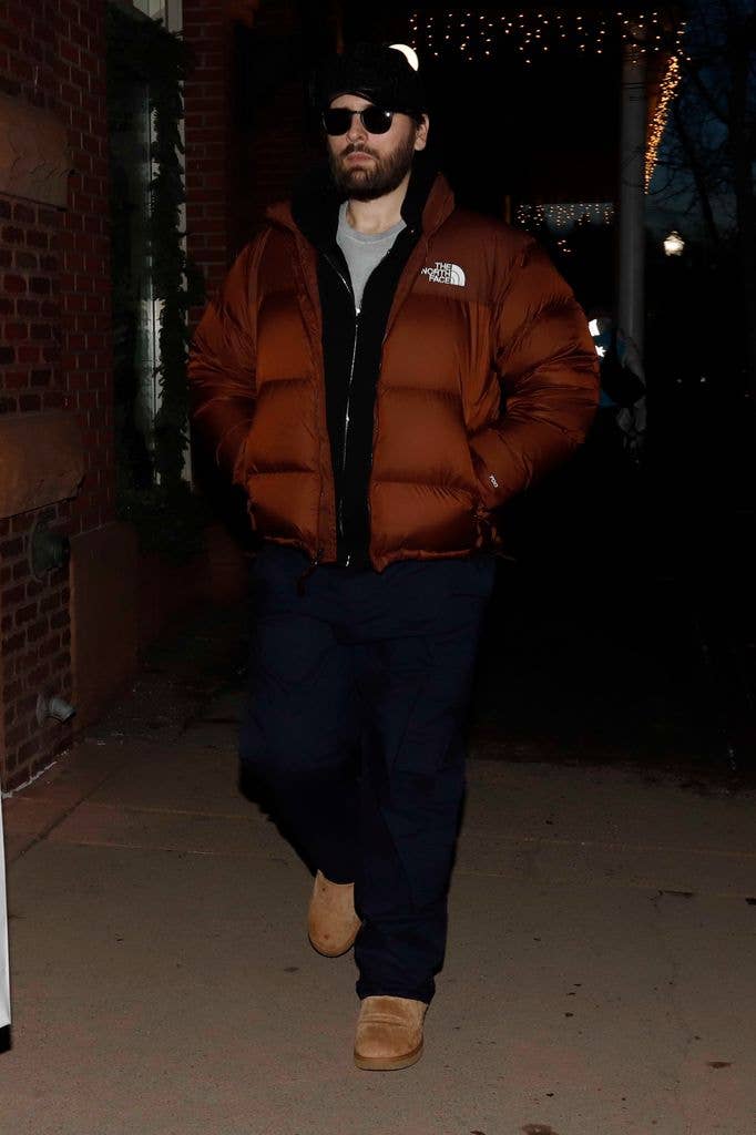 Scott Disick in Aspen wearing sunglasses and cap