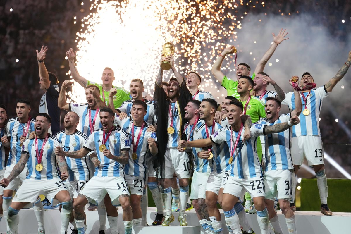 Argentina captain Lionel Messi lifts the FIFA World Cup trophy following victory over France via a penalty shootout in the FIFA World Cup Final match at the Lusail Stadium in Lusail, Qatar. 