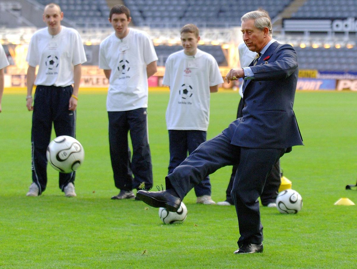 The Prince of Wales takes a penalty during a visit to Newcastle United's St James' Park ground.