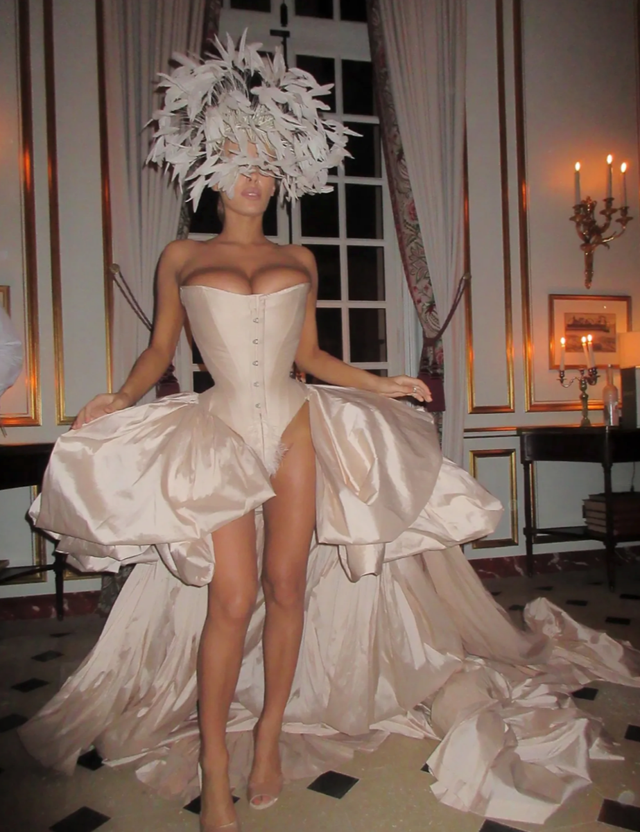 Bianca Censori embraced the evening's lavish masked-ball theme with an avant-garde corset ensemble as she celebrated alongside friends at the historic Palace of Versailles.
