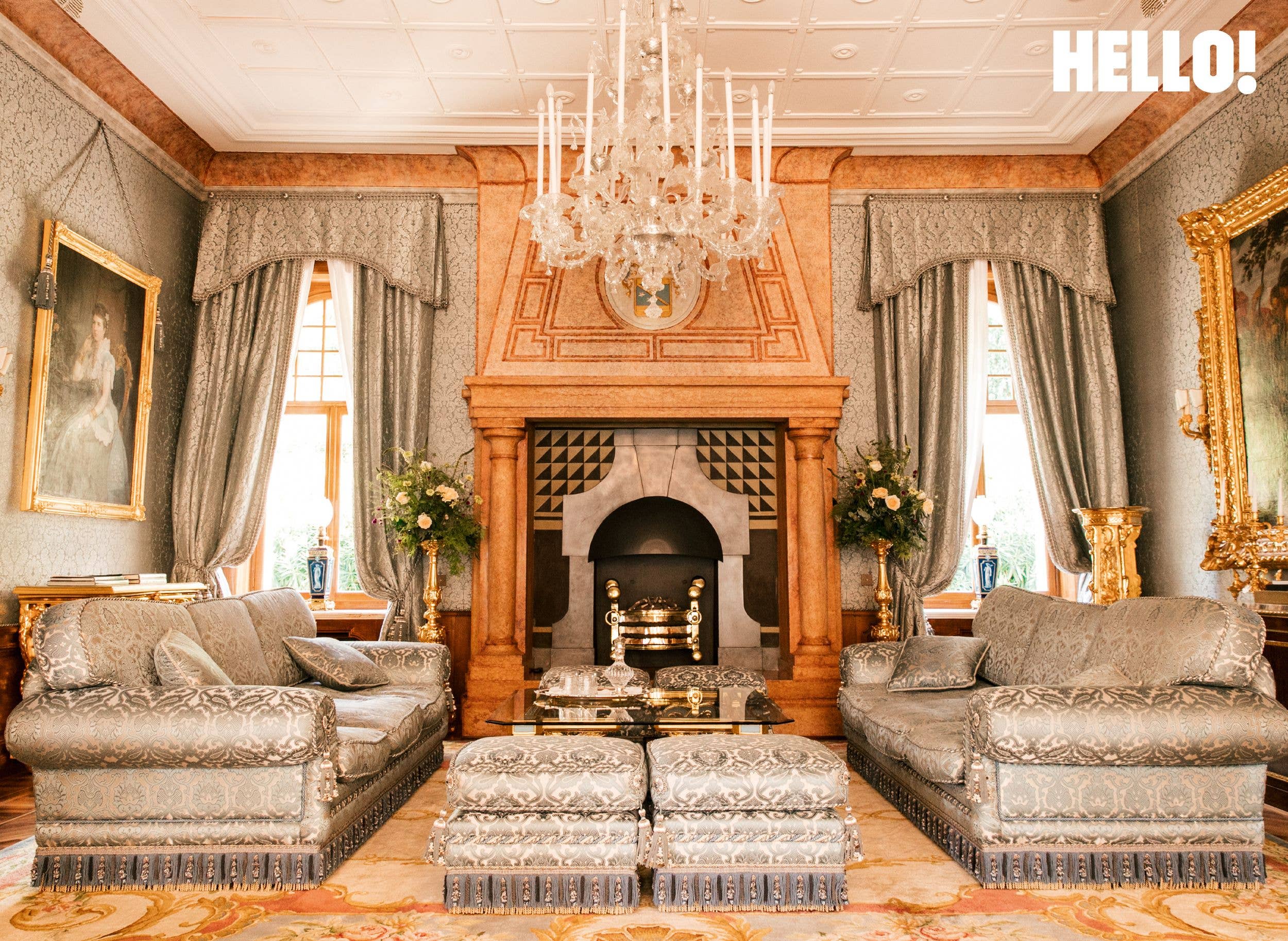 The opulent drawing room, dominated by an imposing fireplace 