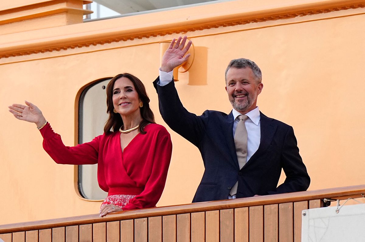 Queen Mary turns heads in a vibrant scarlet dress and romantic cinched look during Denmark's royal summer cruise