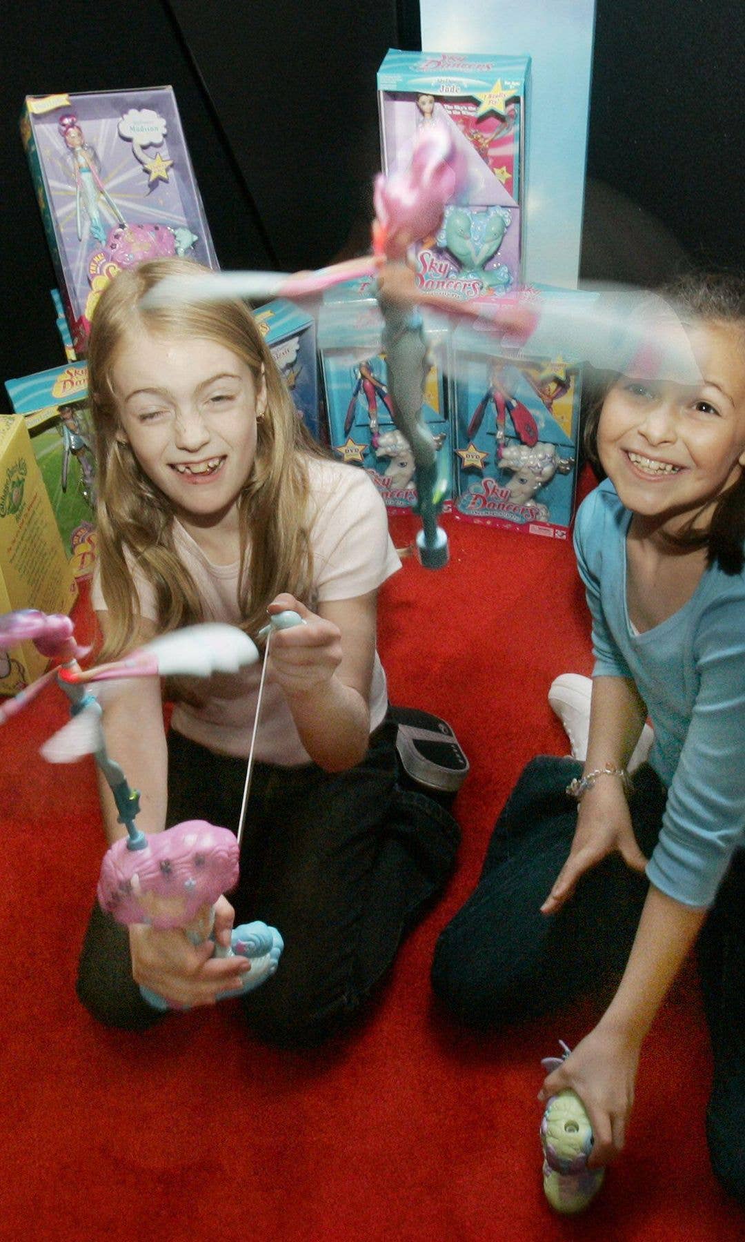 Two girls playing with a Sky Dancer toy
