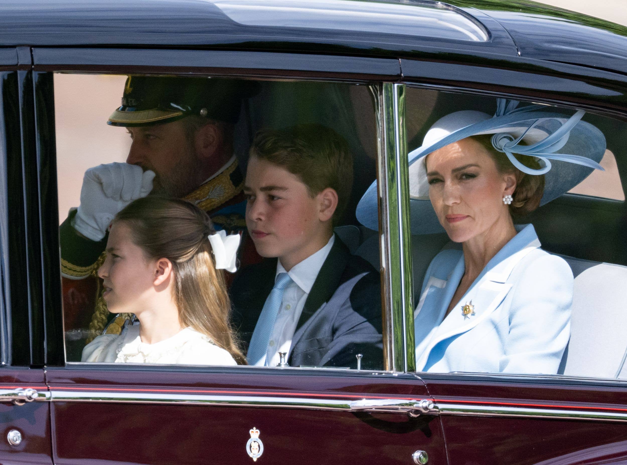 The Prince and Princess of Wales arrive at Buckingham Palace with their children before the parade