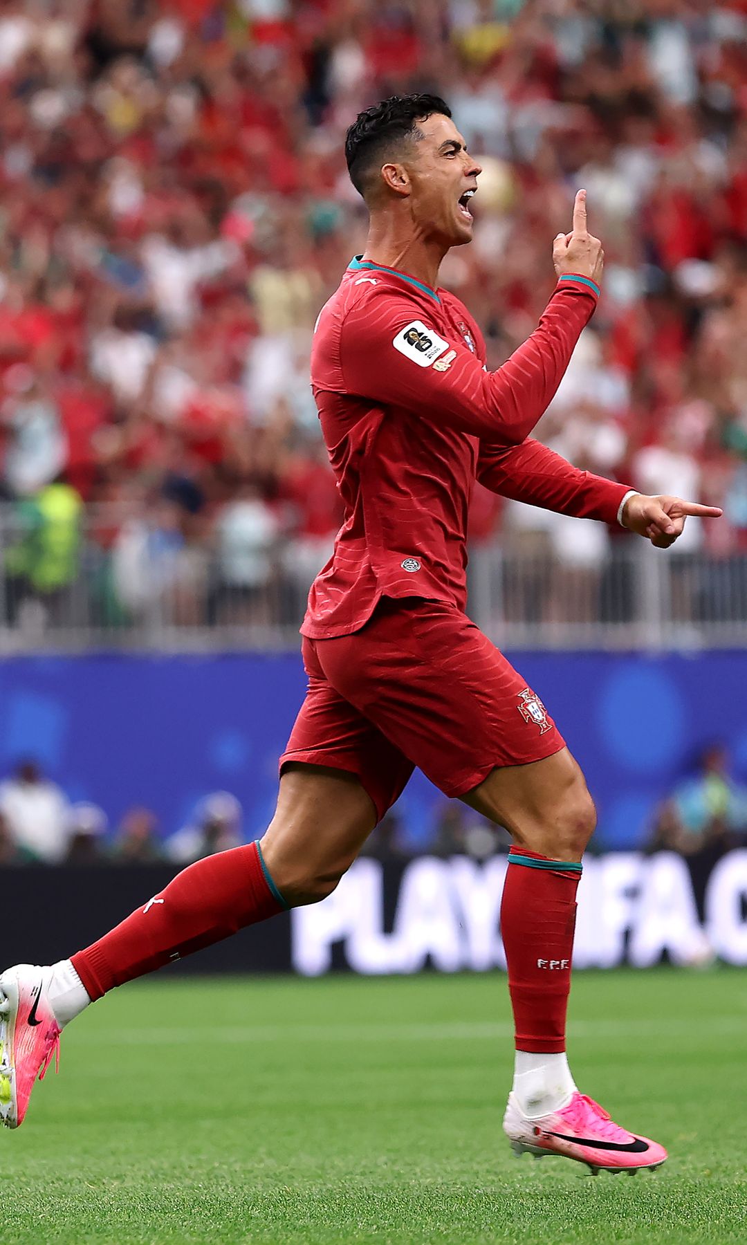 Cristiano Ronaldo #7 of Portugal celebrates scoring his team's first goal during the FIFA World Cup 2026 Group K match between Portugal and Uzbekistan