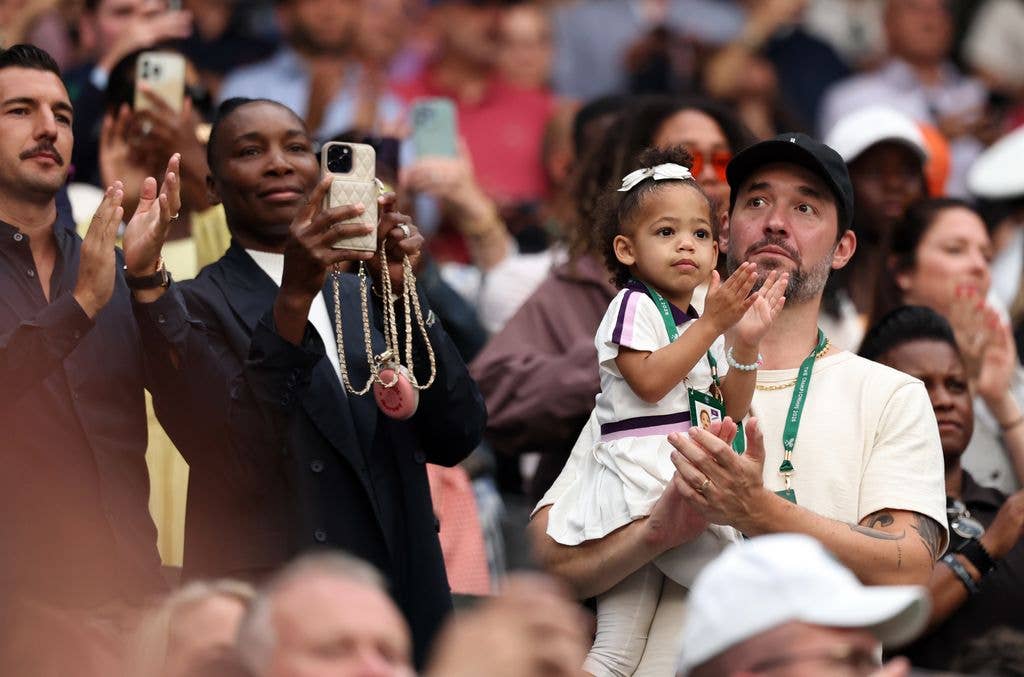 Alexis Ohanian, partner of Serena Williams of United States, holds daughter Adira River Ohanian as they watch Serena Williams of United States play against Maya Joint of Australia during their Ladies' Singles first round match on day two of The Championships Wimbledon 2026 at All England Lawn Tennis and Croquet Club on June 30, 2026 in London, England.