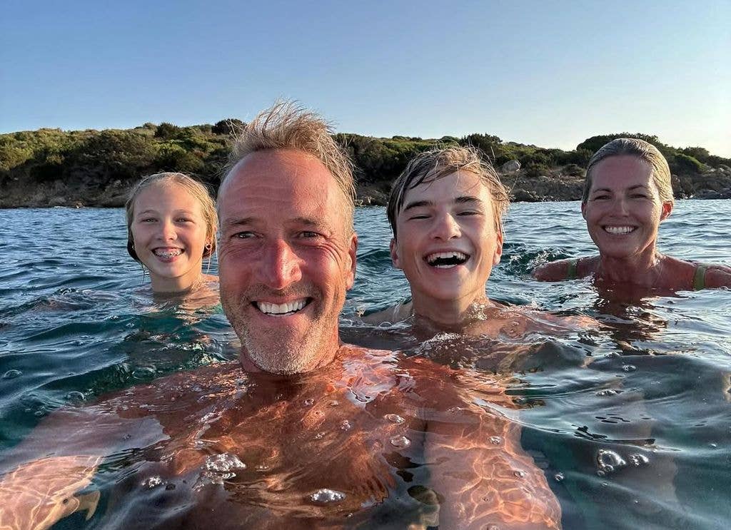 Ben shared a picture of himself, his wife Marina and their two children enjoying the water