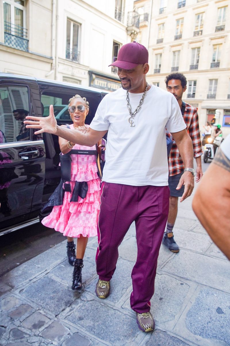 Will Smith and Jada Pinkett Smith coordinated in complementary pink and burgundy looks as they stepped out together in Paris.