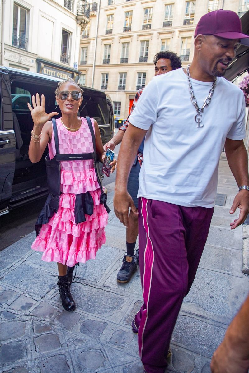 The couple appeared in high spirits as they smiled and greeted onlookers while leaving their hotel in the French capital.