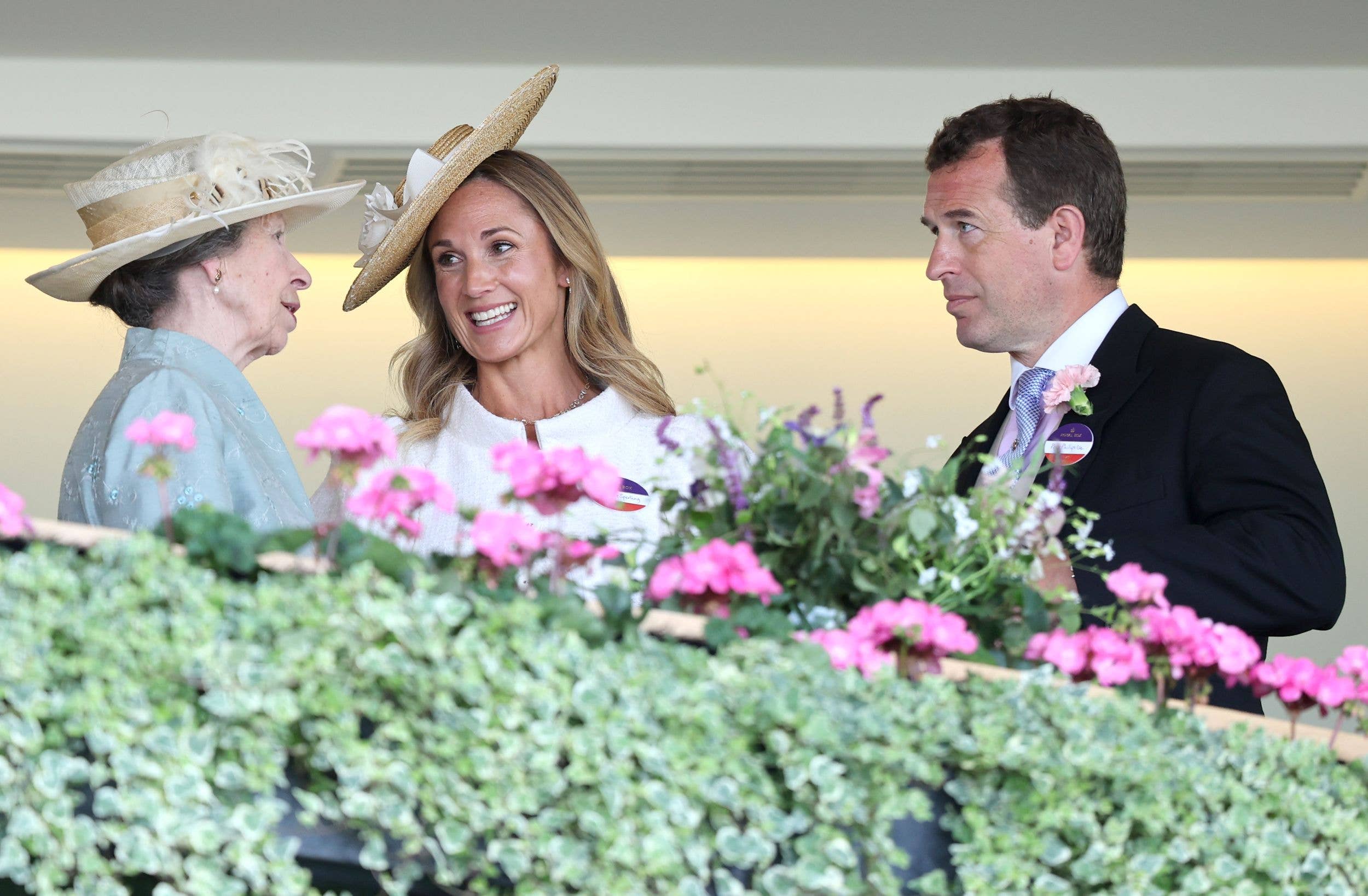 Princess Anne, Harriet Sperling and Peter Phillips speak with each other as they attend day one of Royal Ascot