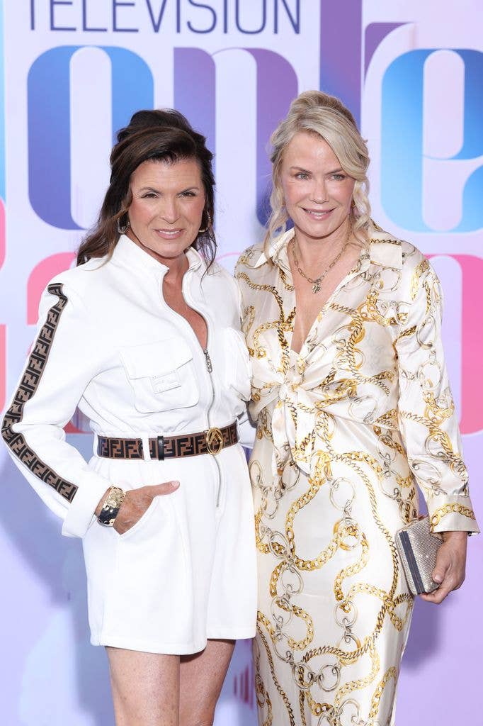 Kimberlin Brown and Katherine Kelly Lang with their arms around each other smiling