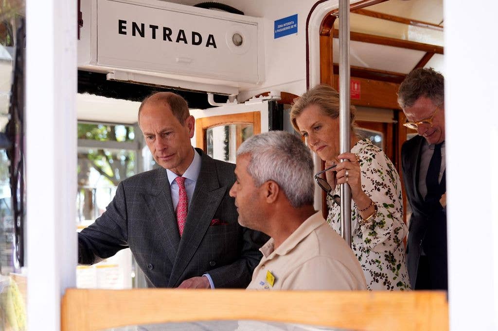 The Duke and Duchess of Edinburgh view the inside of a tram in Lisbon