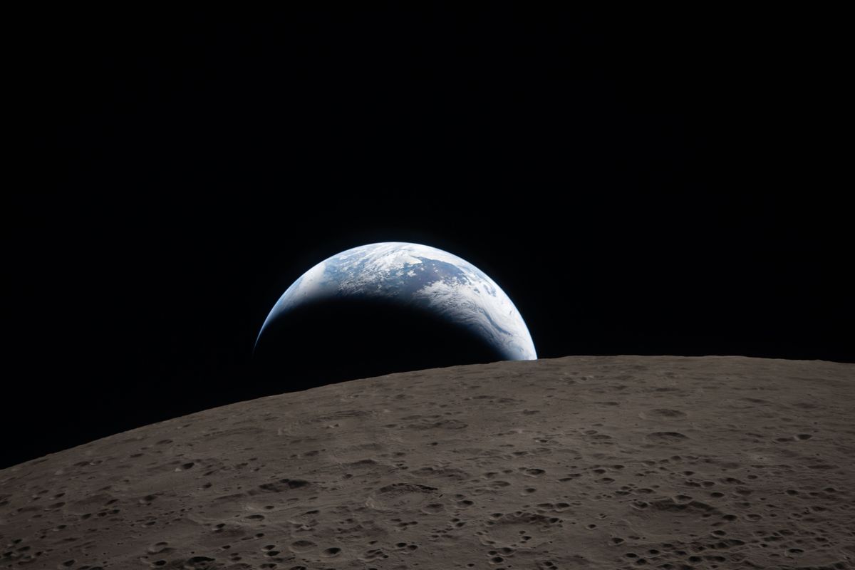 Earthset captured through the Orion spacecraft window at 6:41 p.m. EDT, April 6, 2026