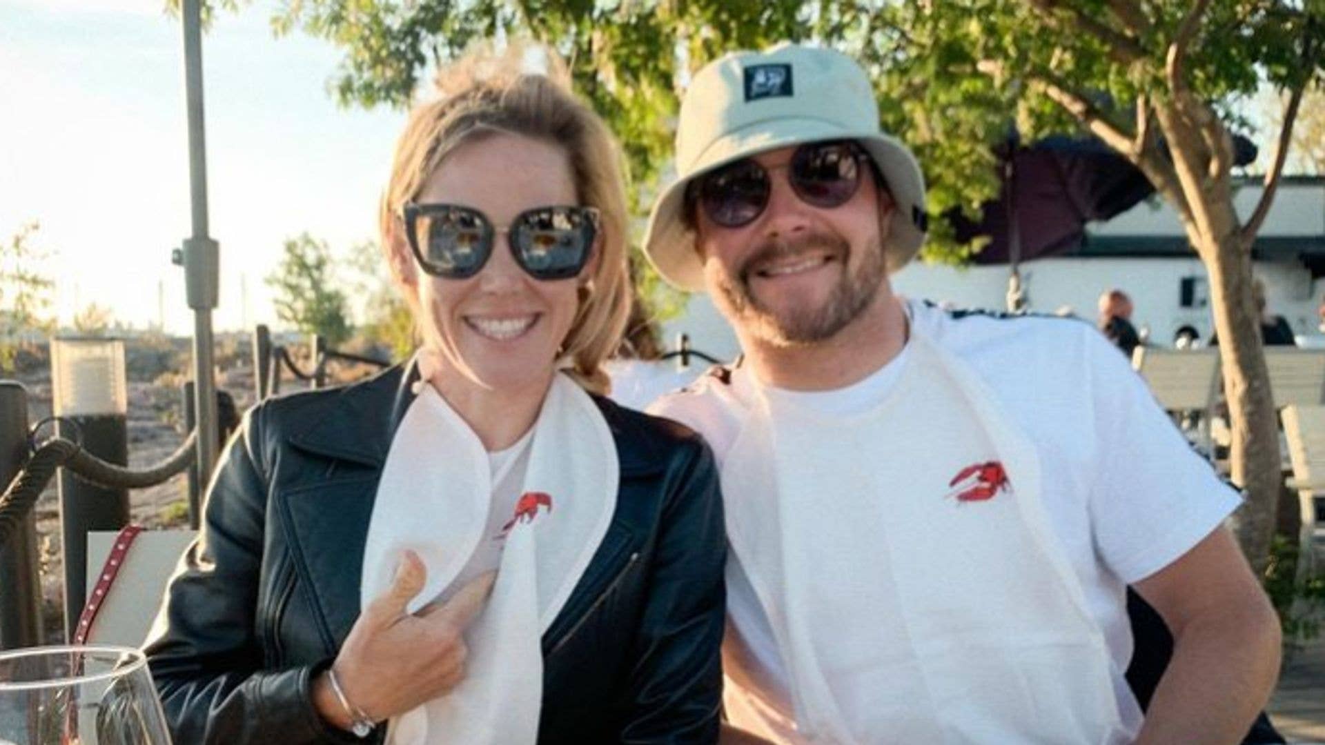 Tiffany Cromwell and Valtterri Bottas in front of plate of shrimp
