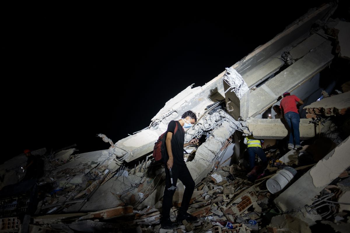 Rescue teams continue searching the rubble of collapsed buildings for survivors following the devastating earthquake in Caraballeda, La Guaira, Venezuela.