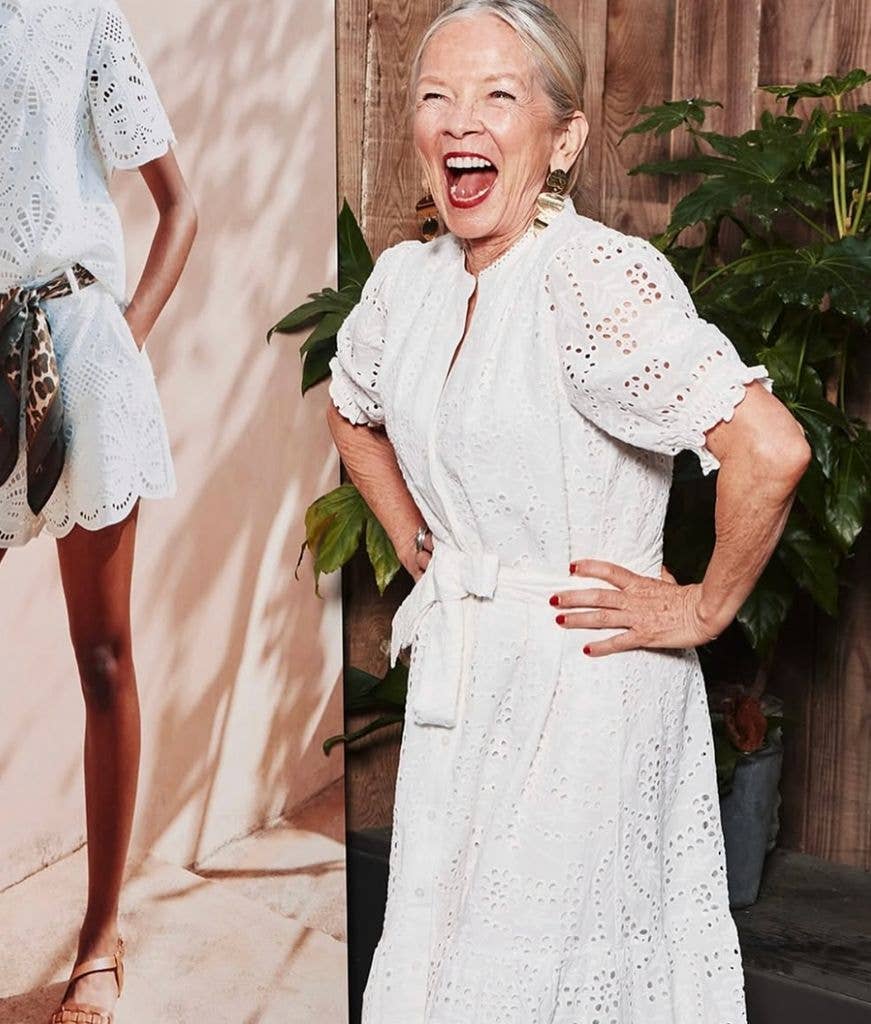Jo Good wearing a white lace dress with red lipstick