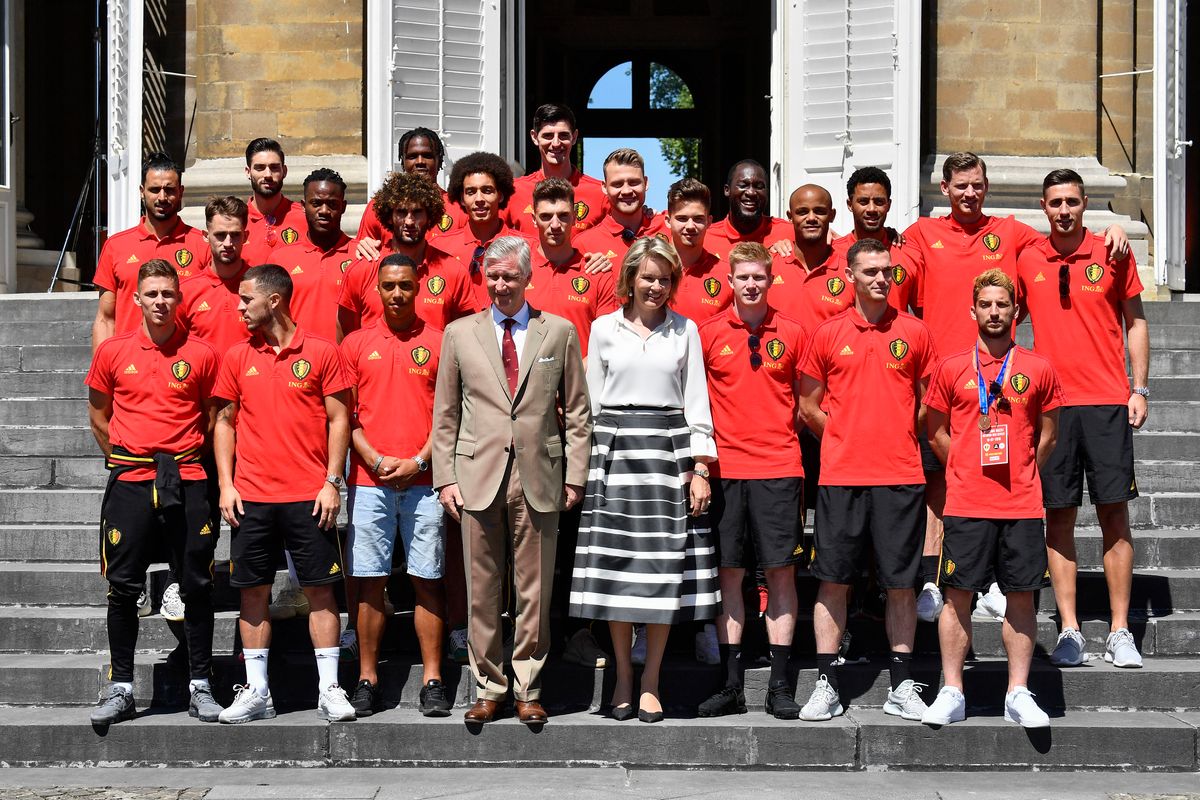 Belgium's King Philippe and Queen Mathilde of Belgium pose with Belgium's team players at the Royal castle in Laeken, as Belgian national soccer team returns from the semi-final of the soccer World cup in Russia on July 15, 2018
