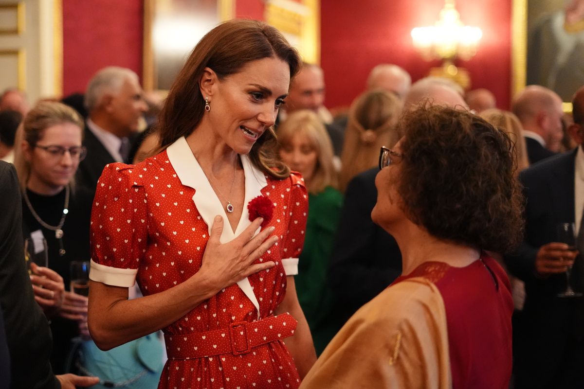 A white collar, delicate heart print, and ruby accessories gave Kate's Rodarte dress a romantic, vintage-inspired feel.