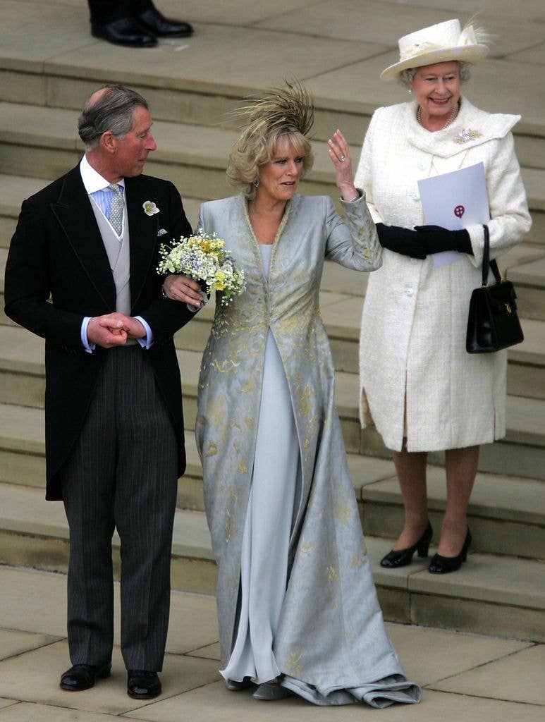 Her Majesty Queen Elizabeth wore a white coat dress to the wedding of Prince Charles and his wife Camilla, Duchess of Cornwall in 2005