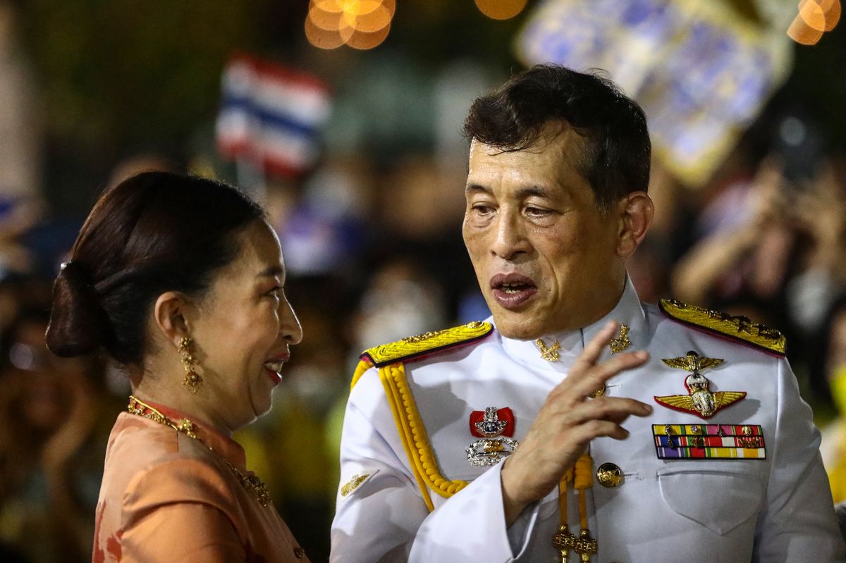 Thailand's King Maha Vajiralongkorn talks to Princess Bajrakitiyabha Mahidol as they greet royalist supporters outside the Grand Palace in Bangkok on November 1, 2020 