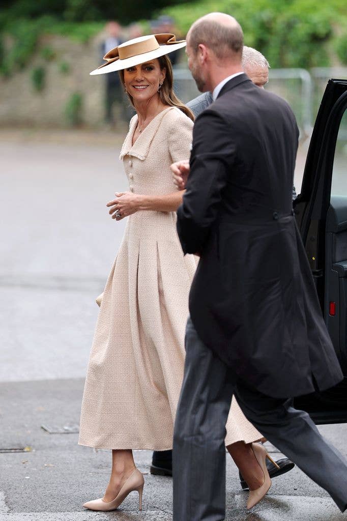 Catherine, Princess of Wales and Prince William, smiling and walking together
