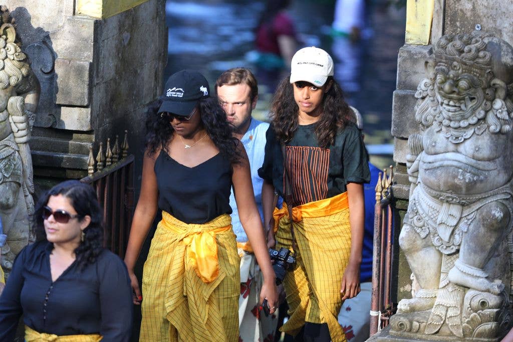 Sasha (centre L) and Malia (centre R) in Bali, 2017