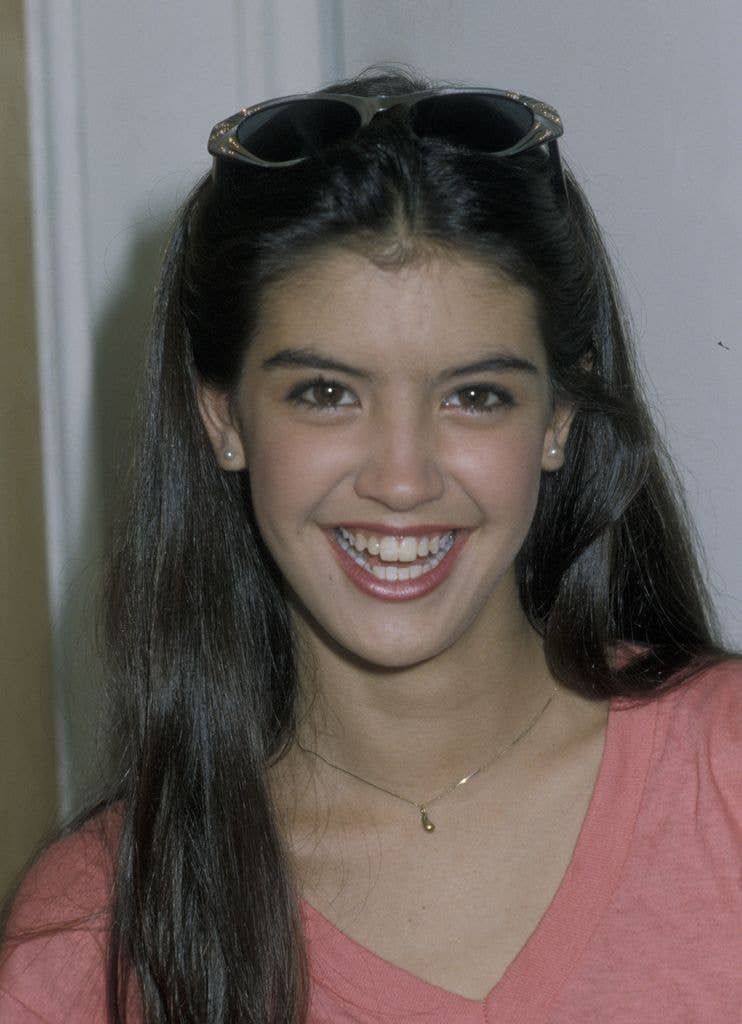 Phoebe Cates in a headshot for Beaumont Modeling Agency Anniversary Party wearing a pink tshirt and sunglasses on her head.