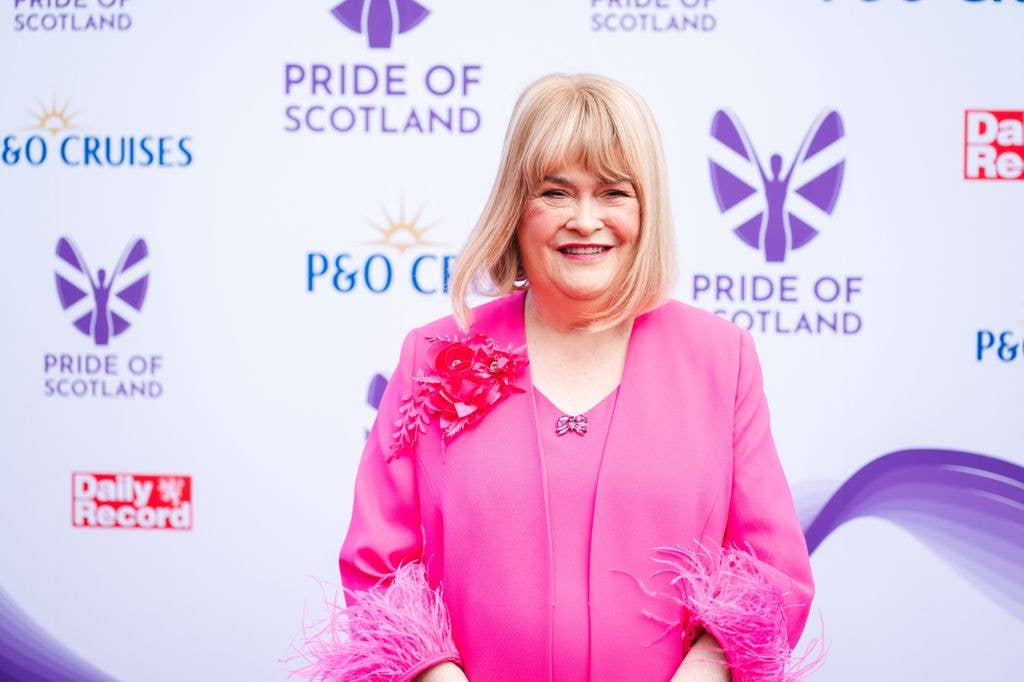 A photo of Susan Boyle wearing a pink dress