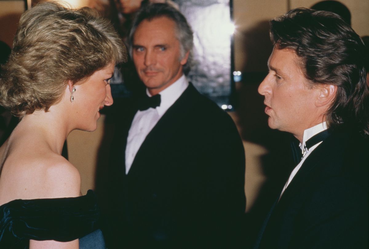 Diana, Princess of Wales talking to American actor Michael Douglas with British actor Terence Stamp in the back -  at the London premiere of the film 'Wall Street'