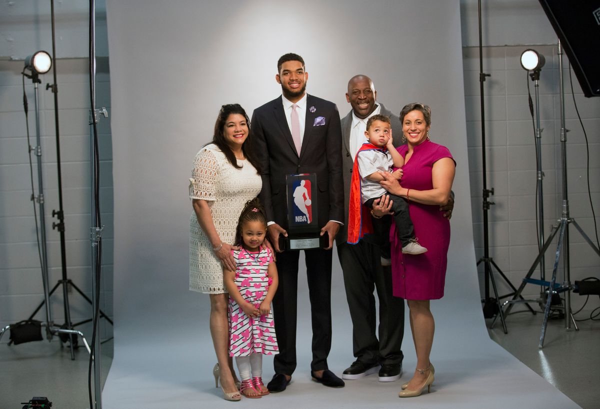 Karl-Anthony Towns poses for a portrait with his family before the announcement of his NBA Rookie of the Year Award. From left, mother Jacqueline Cruz, niece Jolani Ammons, father Karl, nephew Anthony Maximilian Ammons, and sister Lachelle.