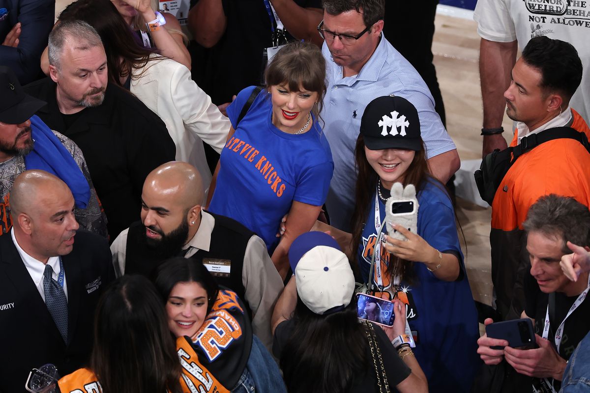 Taylor Swift takes a selfie with a fan after Game Four of the 2026 NBA Finals.