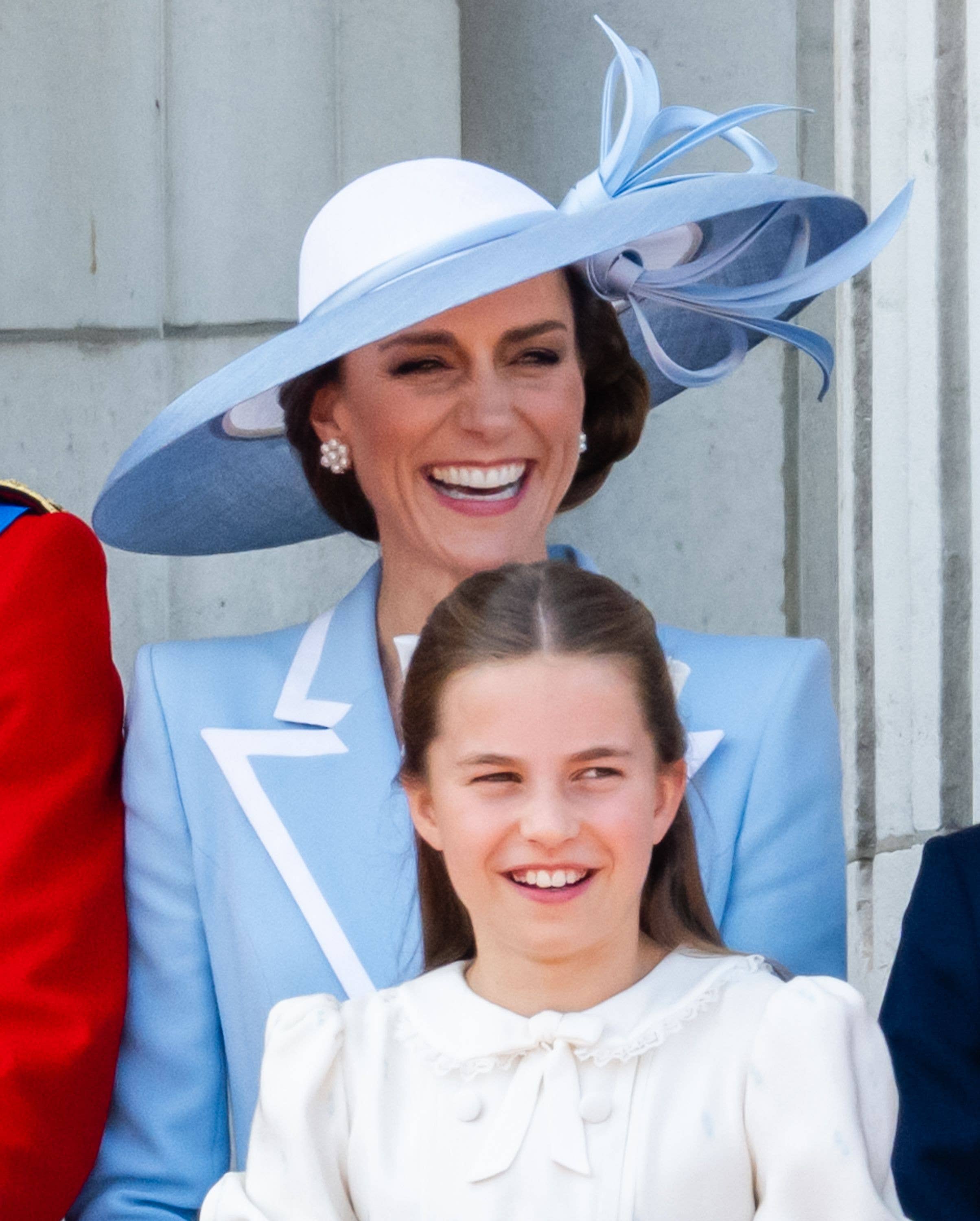 As Charlotte laughs with their mother, Catherine