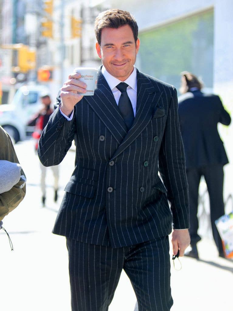 Dylan McDermott in a striped, double breasted suit on the set of 'Law and Order: Organized Crime' in 2021.