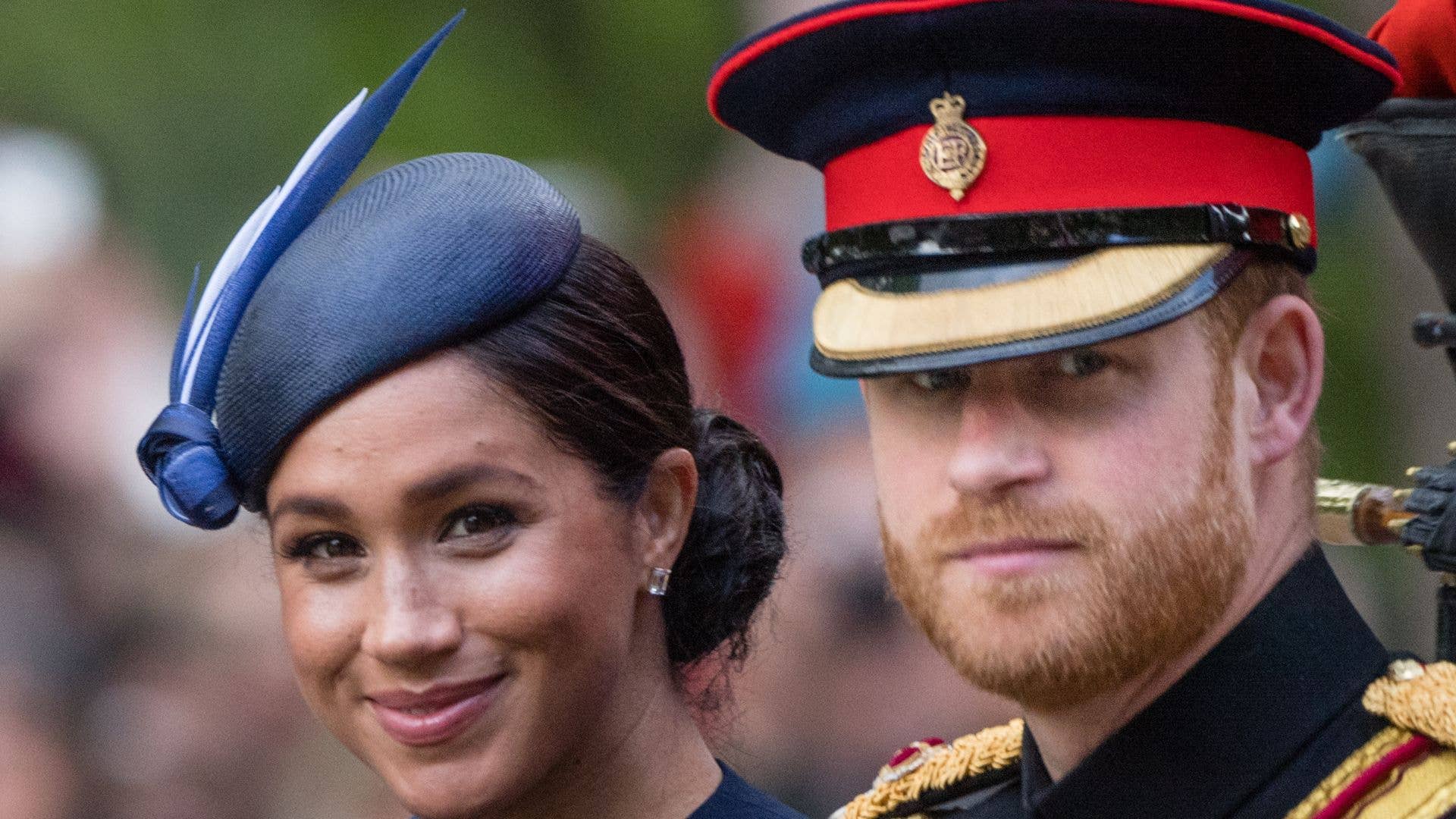 Meghan Markle and Prince Harry riding in a carriage