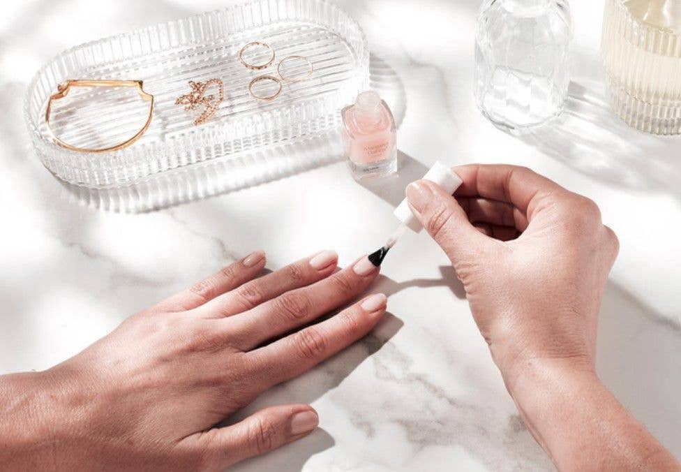 A strengthening top coat, like this one from Margaret Dabbs is key