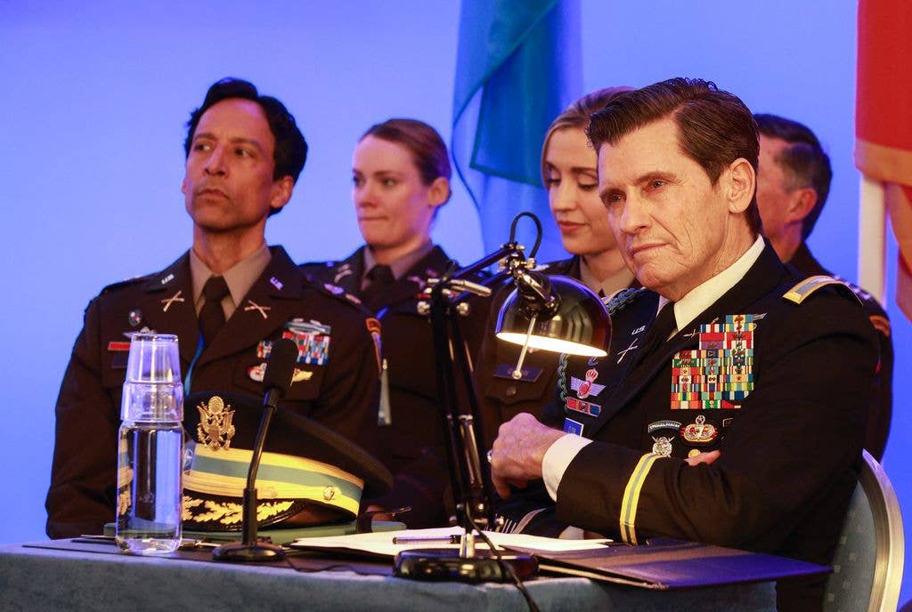 Danny Pudi and Denis Leary in the "NATOcean's Eleven" Season Finale episode of GOING DUTCH