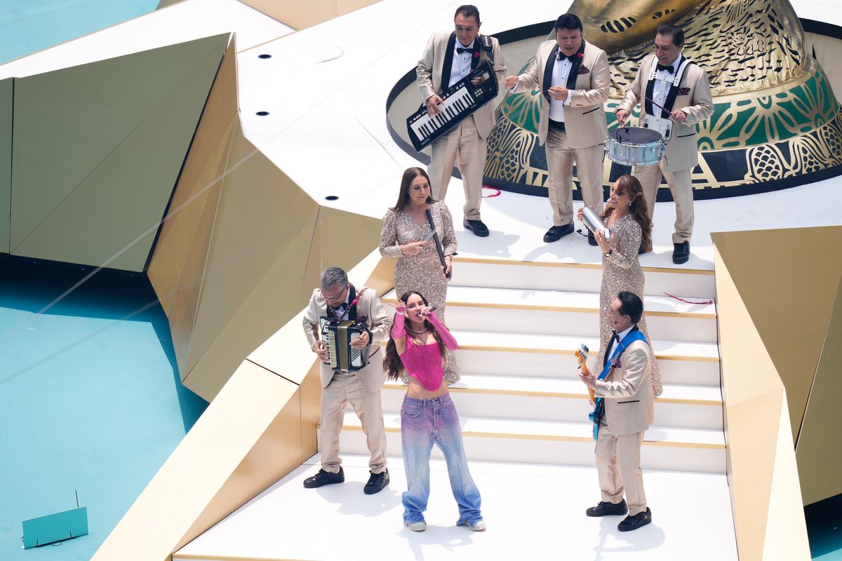 Belinda and Los Ángeles Azules share the stage in a vibrant musical performance at the World Cup opening show.