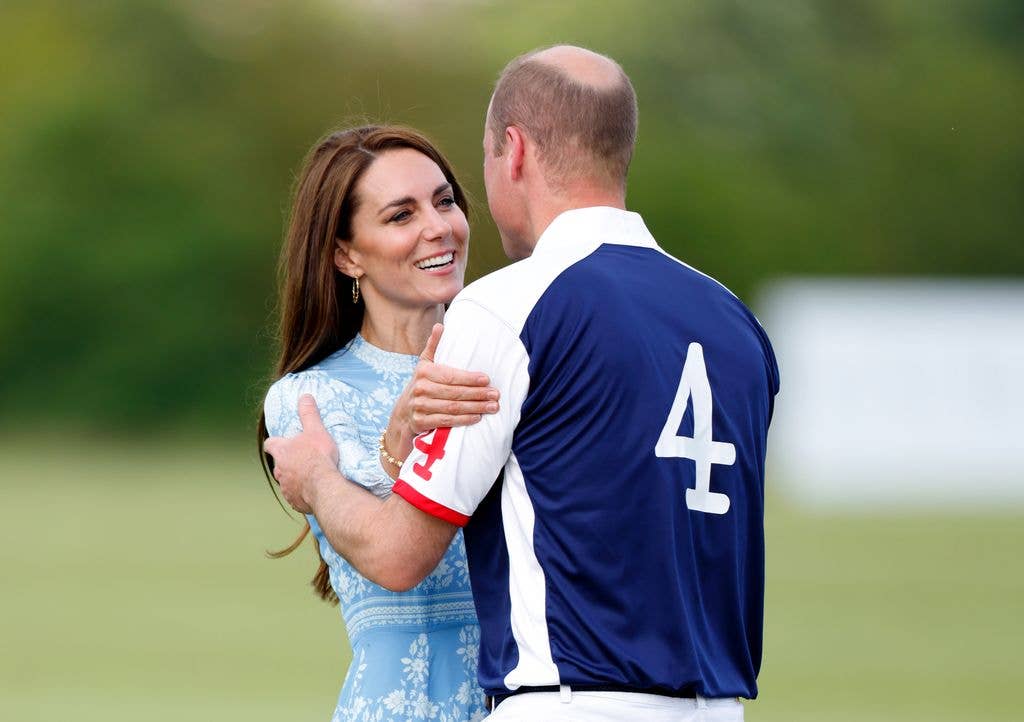 The Princess of Wales embraces Prince William, Prince of Wales during the prize giving following the Out-Sourcing Inc. Royal Charity Polo Cup 2023 at Guards Polo Club, Flemish Farm on July 6, 2023