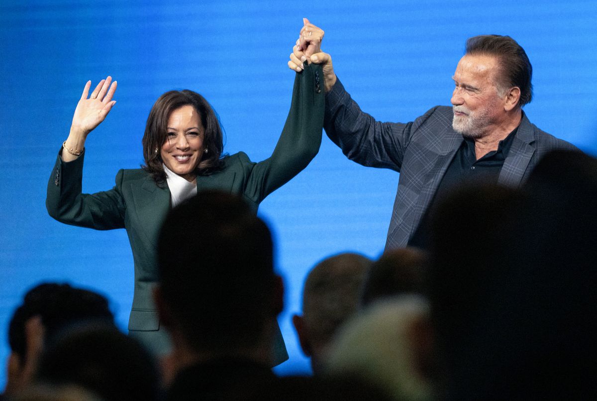 Schwarzenegger and former US Vice-President Kamala Harris react at the end of a panel discussion at the Austrian World Summit of the Schwarzenegger Climate Initiative on June 16, 2026 in Vienna, Austria.