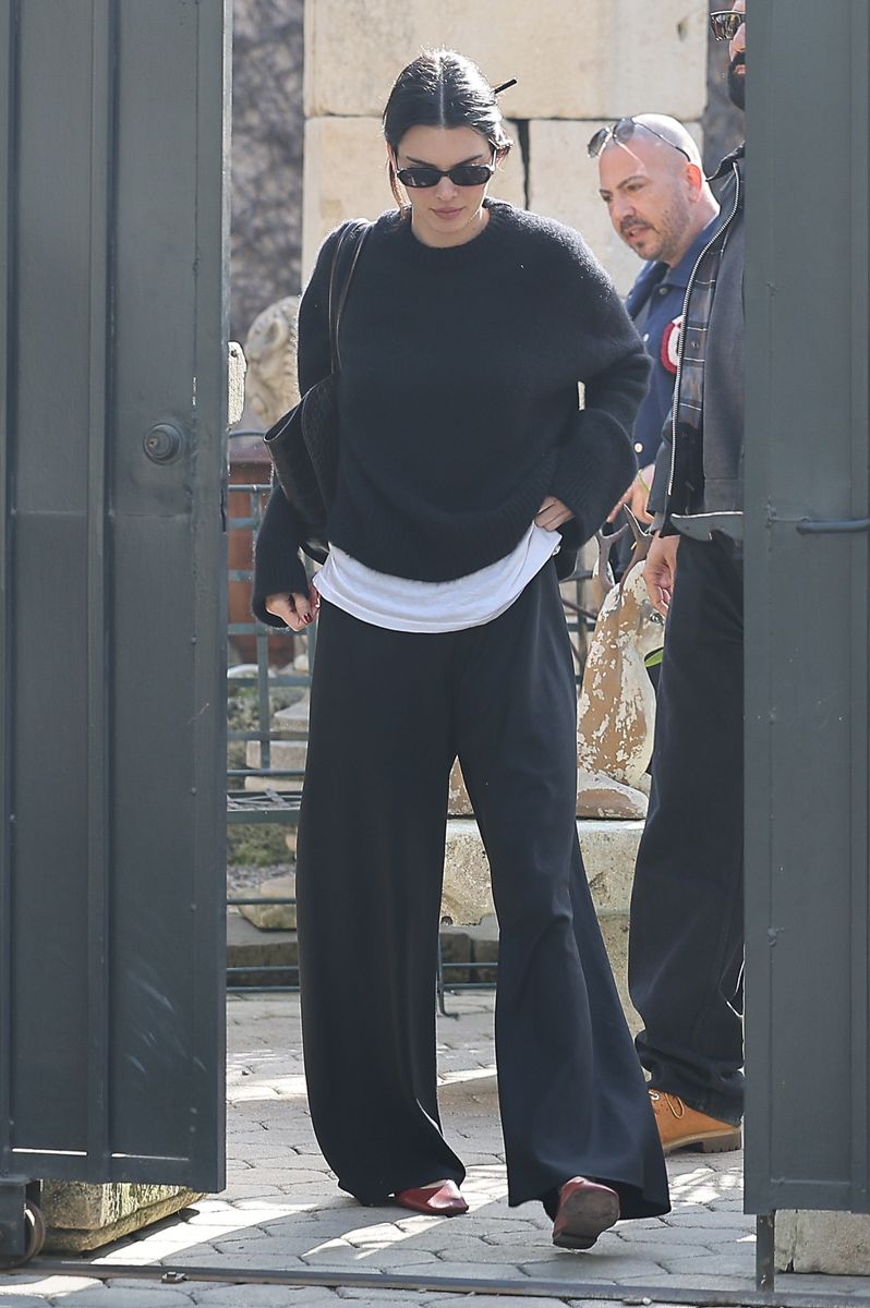 Kendall Jenner's oversized knits, wide-leg trousers, and monochromatic outfits mirror the same minimalist approach.