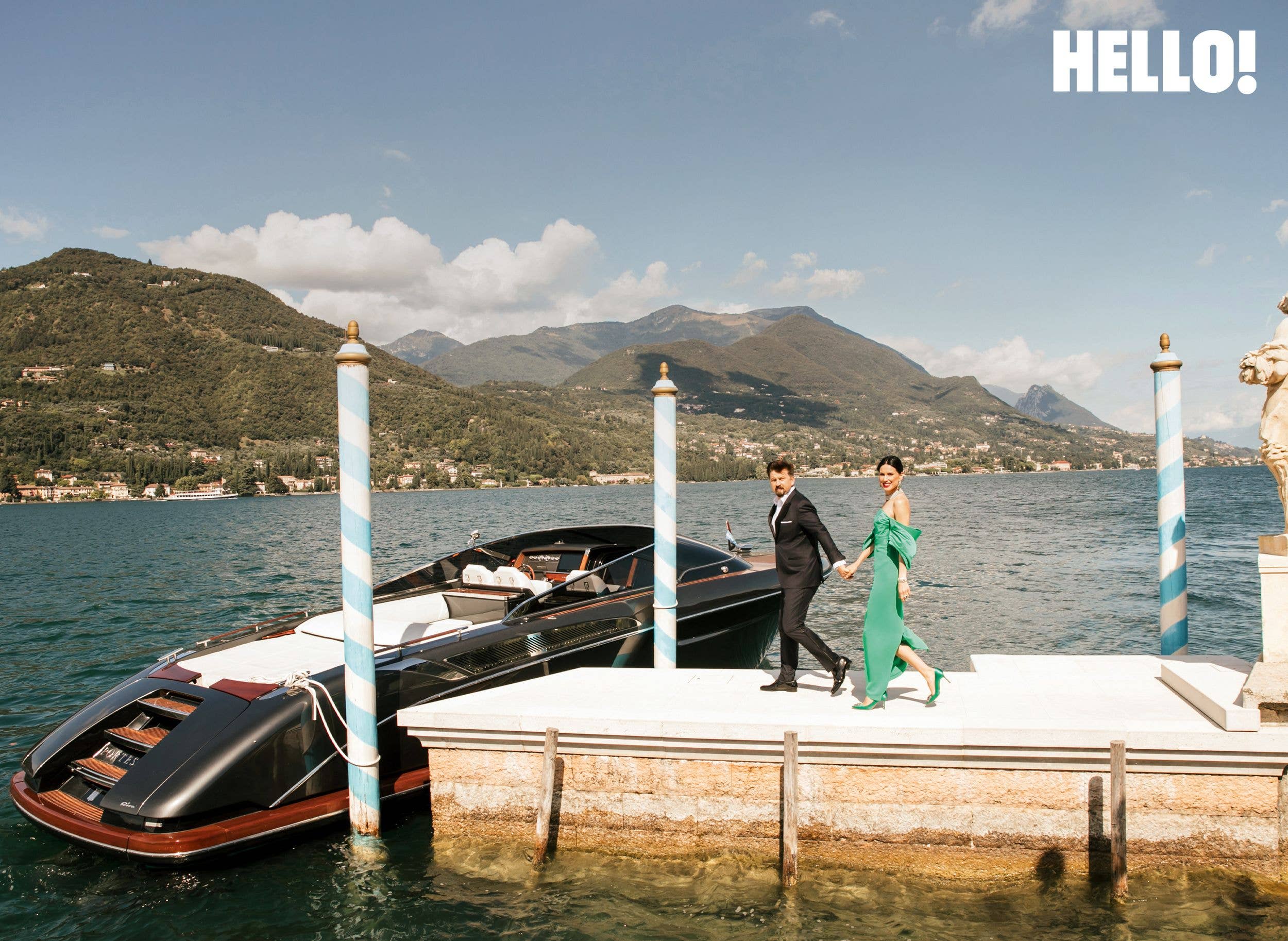 Dariusz and Valeriya walk along the private jetty towards their Riva boat