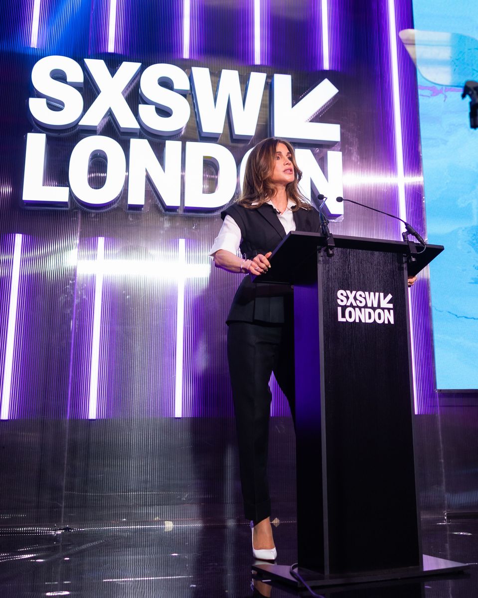 Queen Rania of Jordan delivers a keynote address at SXSW London 2026 wearing a sophisticated monochrome ensemble.