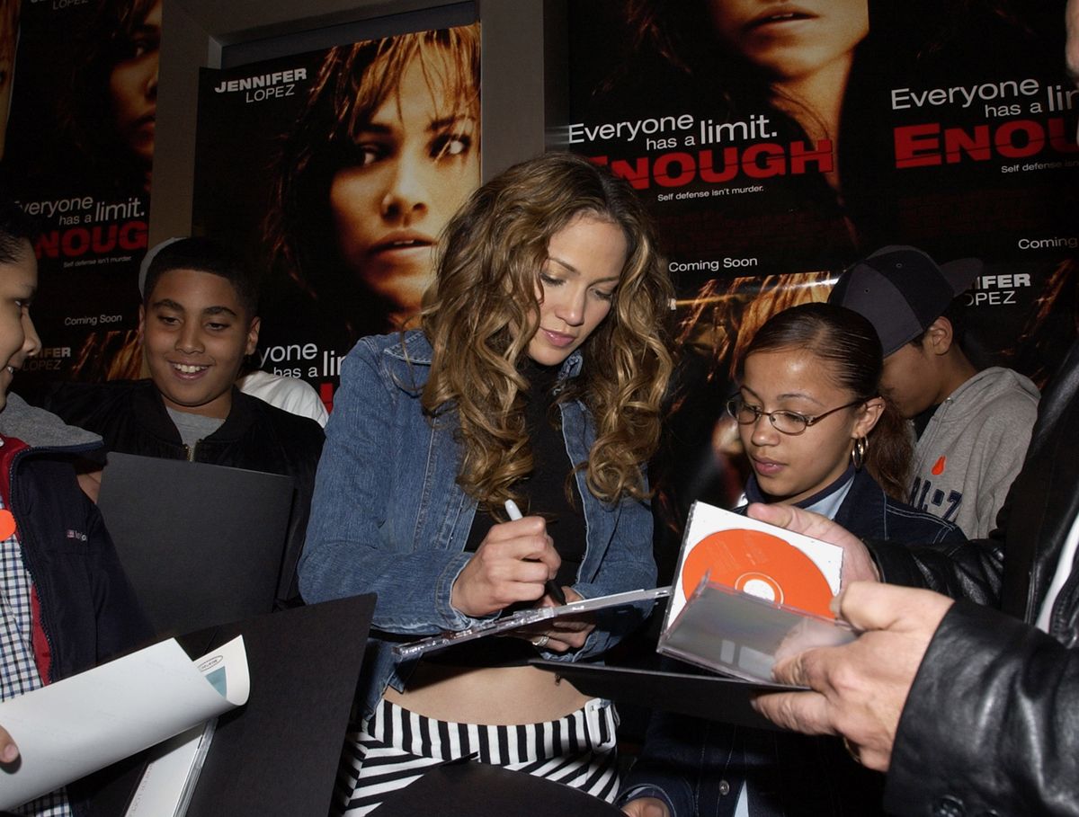 Jennifer Lopez signs autographs for fans outside the screening of her new film "Enough."
