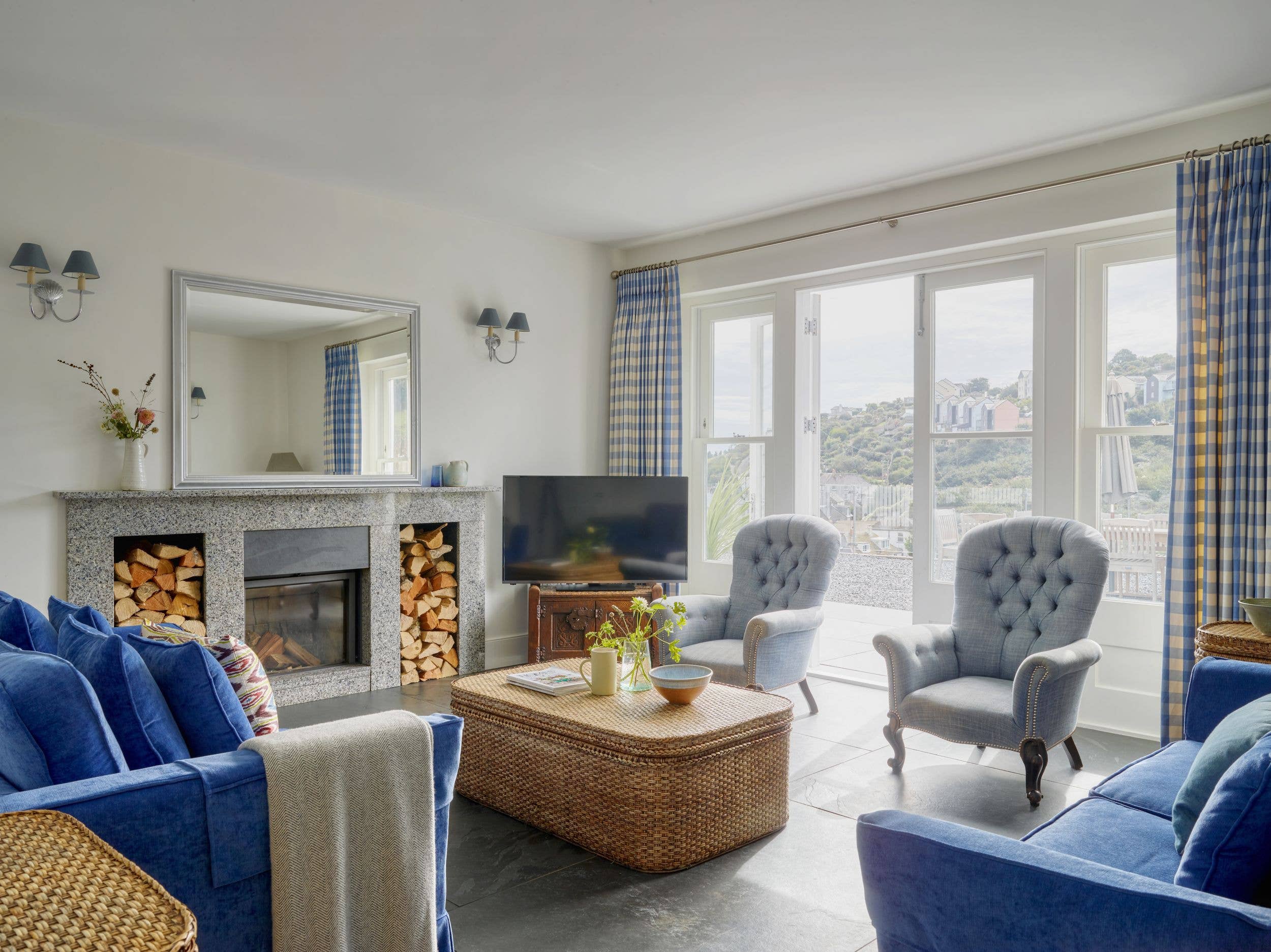 The lounge has large doors that open onto the patio