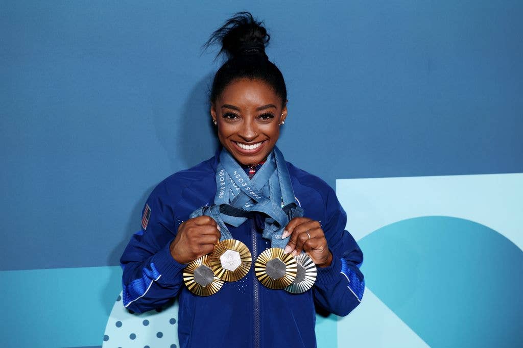 Simone Biles of Team United States poses with her Paris 2024 Olympic medals