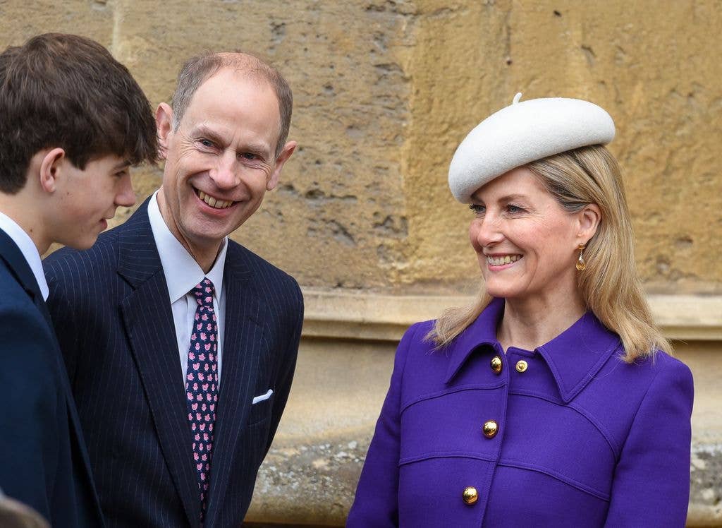 Edward and Sophie looking at son James