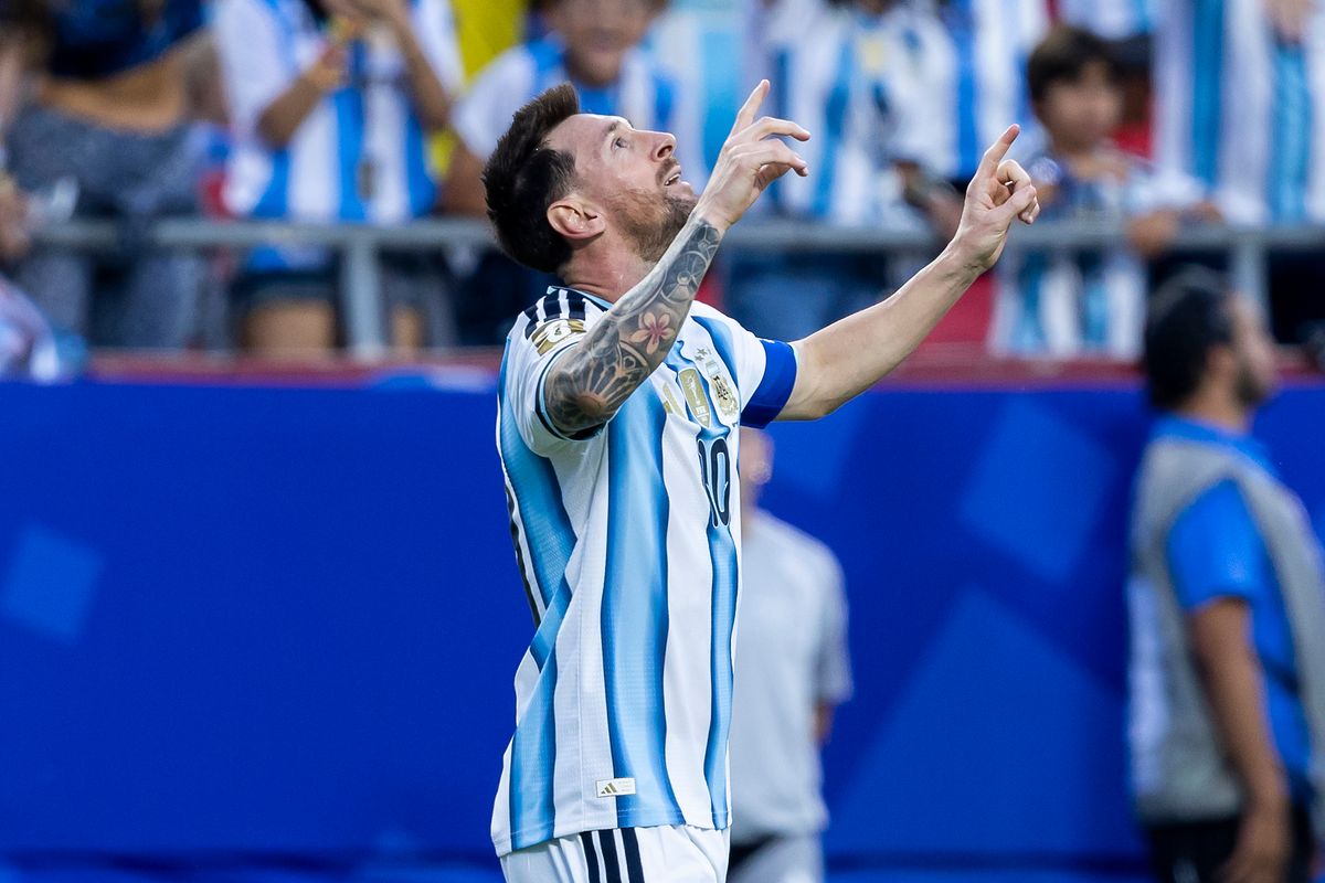 Messi celebrates after his opening goal against Algeria