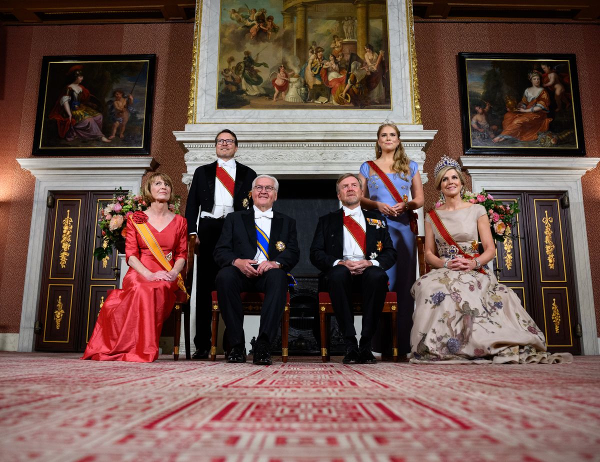 Crown Princess Amalia chose a sophisticated burgundy gown featuring a flattering Bardot neckline for the glittering state occasion.